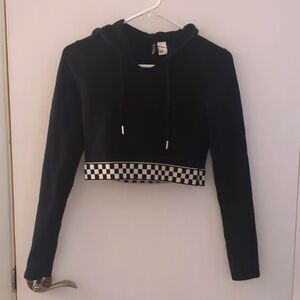 Black long sleeve hooded crop top with checkered elastic waistband